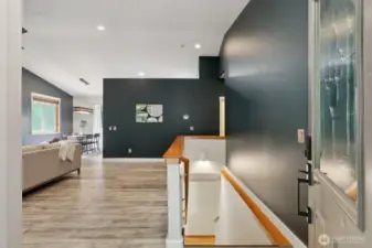 Come on in! The main level offers an open layout and a primary bedroom, while the lower level includes a rec room and three more bedrooms.