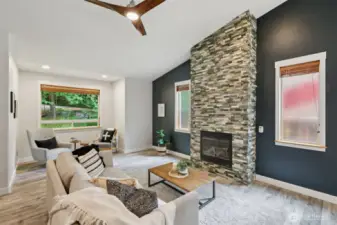 Living room with gas fireplace and cozy reading nook.