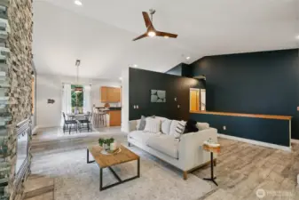 A flexible open layout maintains a smooth flow, with just enough separation from the kitchen for added comfort.