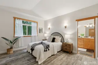 Spacious primary bedroom with 2 closets and ensuite bathroom.