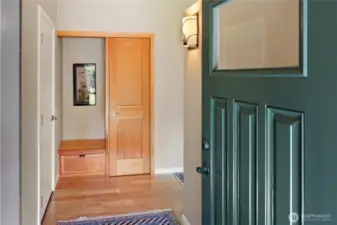 Front door opens to nice entry with closet/seat, nice custom touch.