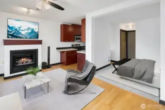 Enjoy this sun filled home with over-sized windows, gleaming hardwoods, gas fireplace, balcony, and an open floor plan. Virtual staging.