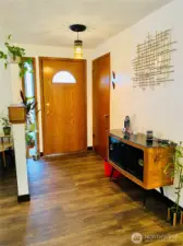 Foyer with fun updated light fixture.