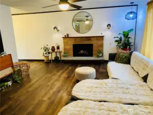 Extra large open living room with gas fireplace for winter nights.