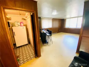 One step down from dining room and kitchen you’ll find a separate pantry with stand up freezer attached to a GIANT bonus room which could easily become an MIL