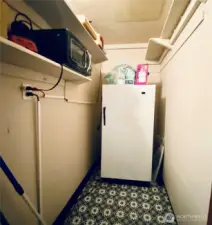 Pantry with room for more shelves along with a great quality stand up freezer which will stay with the house.