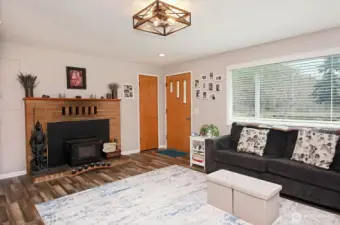 living room with wood fireplace