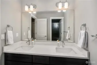 Double vanity with granite counters upstairs in the main bath.