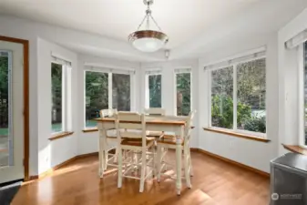 Breakfast Nook off the Kitchen with large windows for views into the back yard.