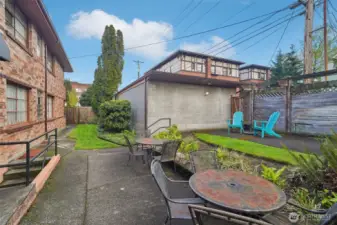 Unwind in the fully fenced common patio area—ideal for relaxing or catching up with neighbors