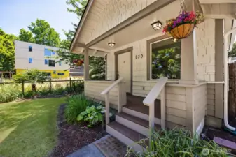 Welcome home! Covered front porch with composite decking invites you in with style and durability.