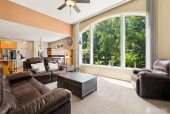 Light-filled living space with soaring ceilings and expansive windows that bring the outdoors in.