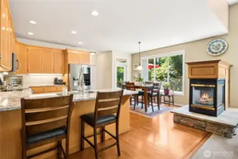 The kitchen offers both a breakfast bar and nook for relaxed dining.