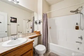 Crisp, well-kept hall bath with traditional charm.