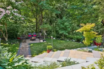Beautifully laid pavers connect the upper yard to the lower yard.