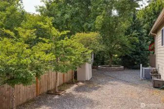 Practical side yard includes extra parking space.
