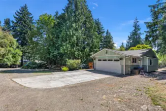 Large level lot with mature trees and plenty of room for RV parking.