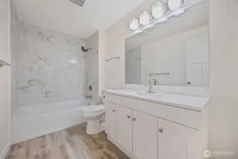 Freshly updated bath featuring stylish fixtures and clean lines.