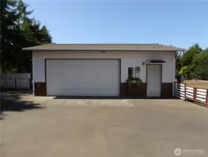 Nice 2 car garage with a small shop area right next to the house.