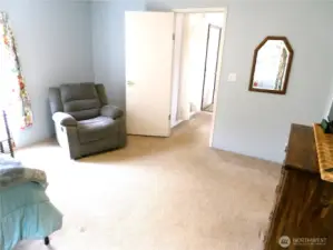 Door exiting the Primary bedroom out into the great room.