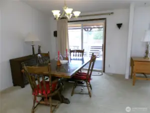 Large dining area as well, that leads to the enclosed covered porch.