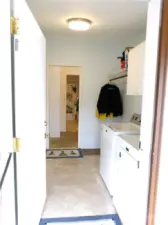 Laundry room goes to the hallway at south end of house.