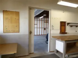 Pocket door from shop area that leads into the 2 car garage.