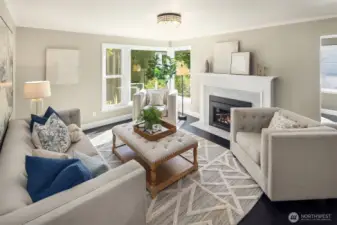 Generous living room w/ gas fireplace and marble surround. Newer windows.