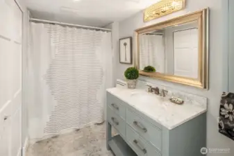 Lower level bathroom with oversized closet for extra linen storage.