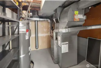 Brand New Water heater. Extra storage here. Behind the furnace is a decent sized finished crawl space for even more storage.