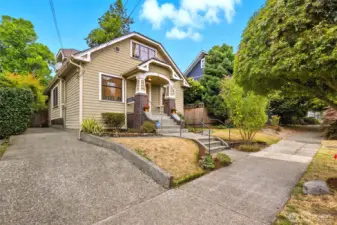 Enjoy your own private driveway to the left, offering parking for up to three vehicles.
