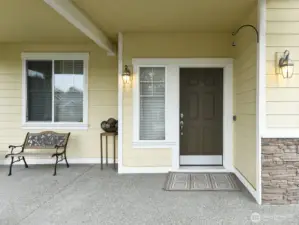 Hardi plank siding. Plenty room for patio furniture. Potted plants.