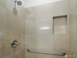 Tile Shower With hand rails.