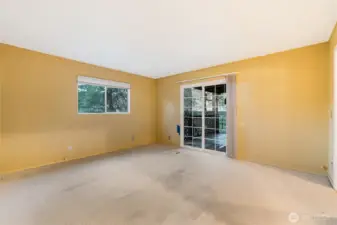 Primary bedroom with slder to back covered deck