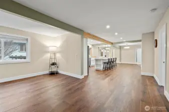 Looking from the living room into the huge open space including the kitchen and dining rooms.