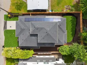 This home contains solar panels. The photo shown above is from a different MN Custom Home with a similar solar array