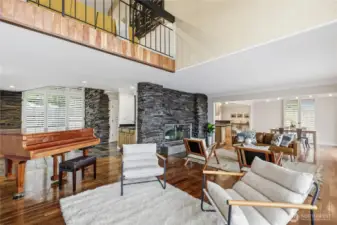 Expansive living room. Fireplace is a bold feature.
