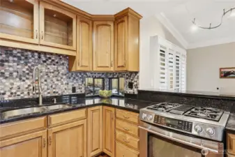 Lovely little window in the corner. Natural gas cooktop.