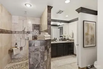 Primary bath ensuite, some items virtually staged.