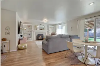 Family Room w/Laminate Floors, Gas Fireplace & White Painted Built-In Bookcases.