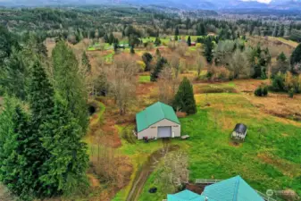 Huge garage, little cottage to your right. What a view!