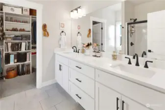 The ensuite includes a  generous vanity and walk in closet!