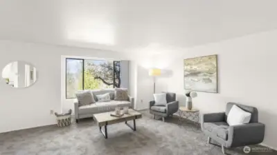 An open floorplan seamlessly flows into the dining area and kitchen.