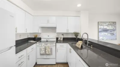 Kitchen opens to the living and dining room areas; perfect for entertaining.