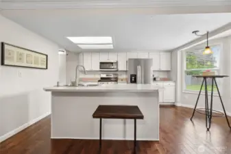 Kitchen has both eat in bar and separate space for an eating nook