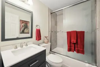 Full bathroom at the end of the hallway