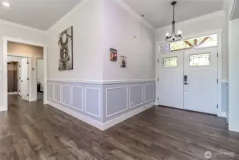 Entryway to open living room.