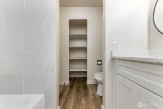 New vinyl flooring and trim. Storage shelves in 2nd level full bathroom.