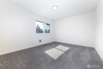2nd bedroom on 2nd level with lots of natural light.