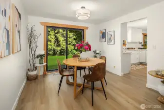 Dining room looking out to back yard, kitchen to the right